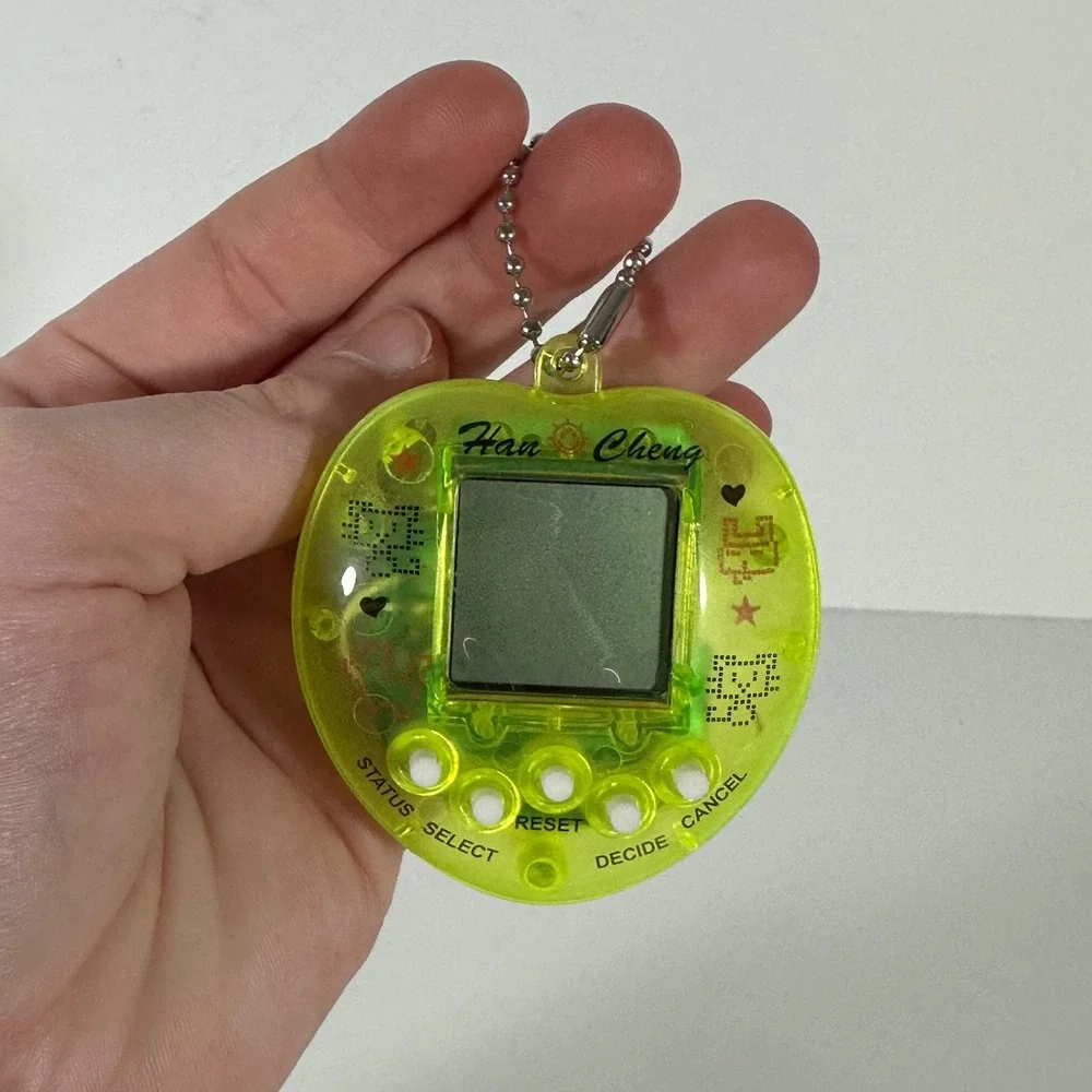 Han Cheng Virtual Pet Handheld Game Neon Lime Green Heart Translucent Retro Toy